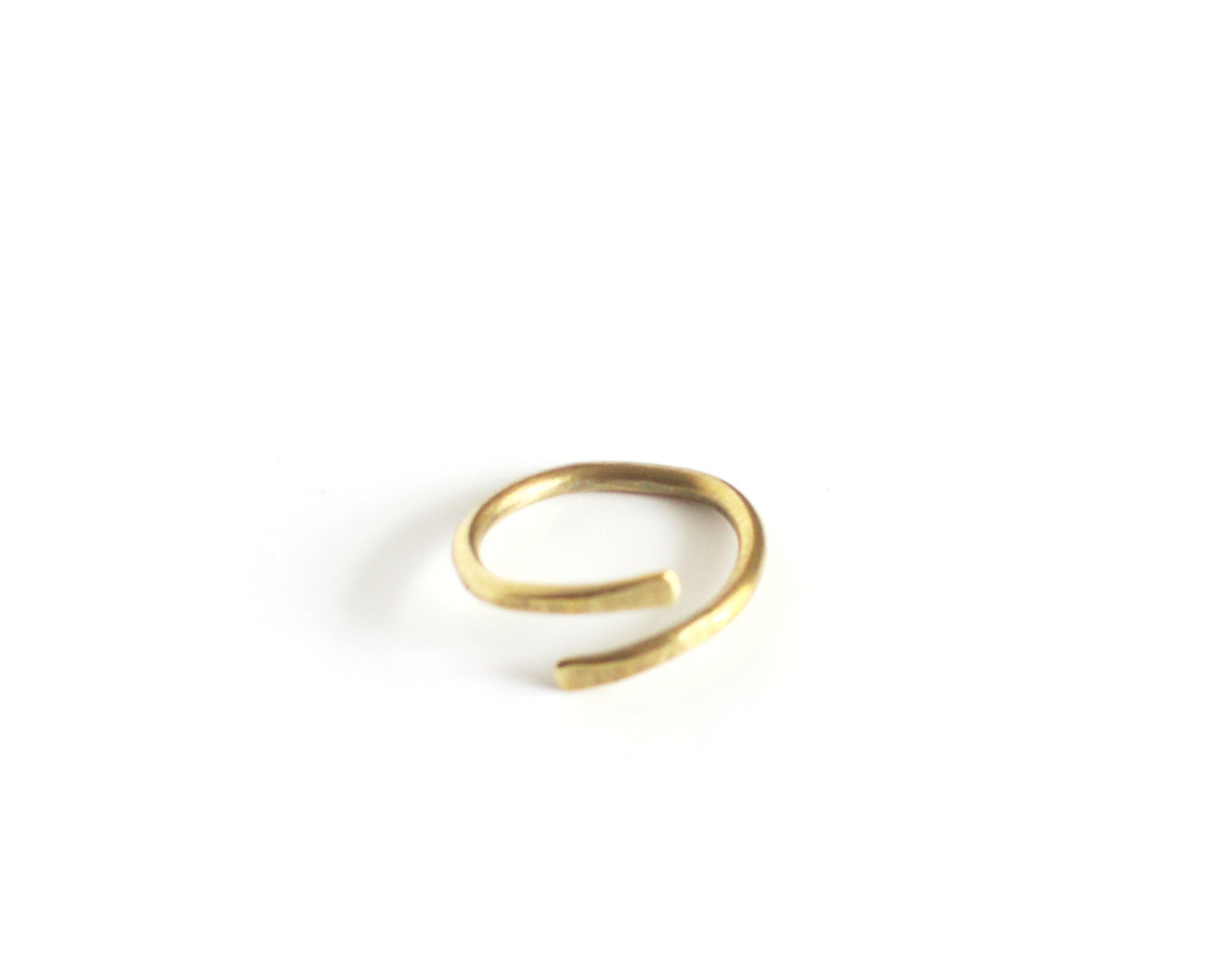 Brass open ring on a white background