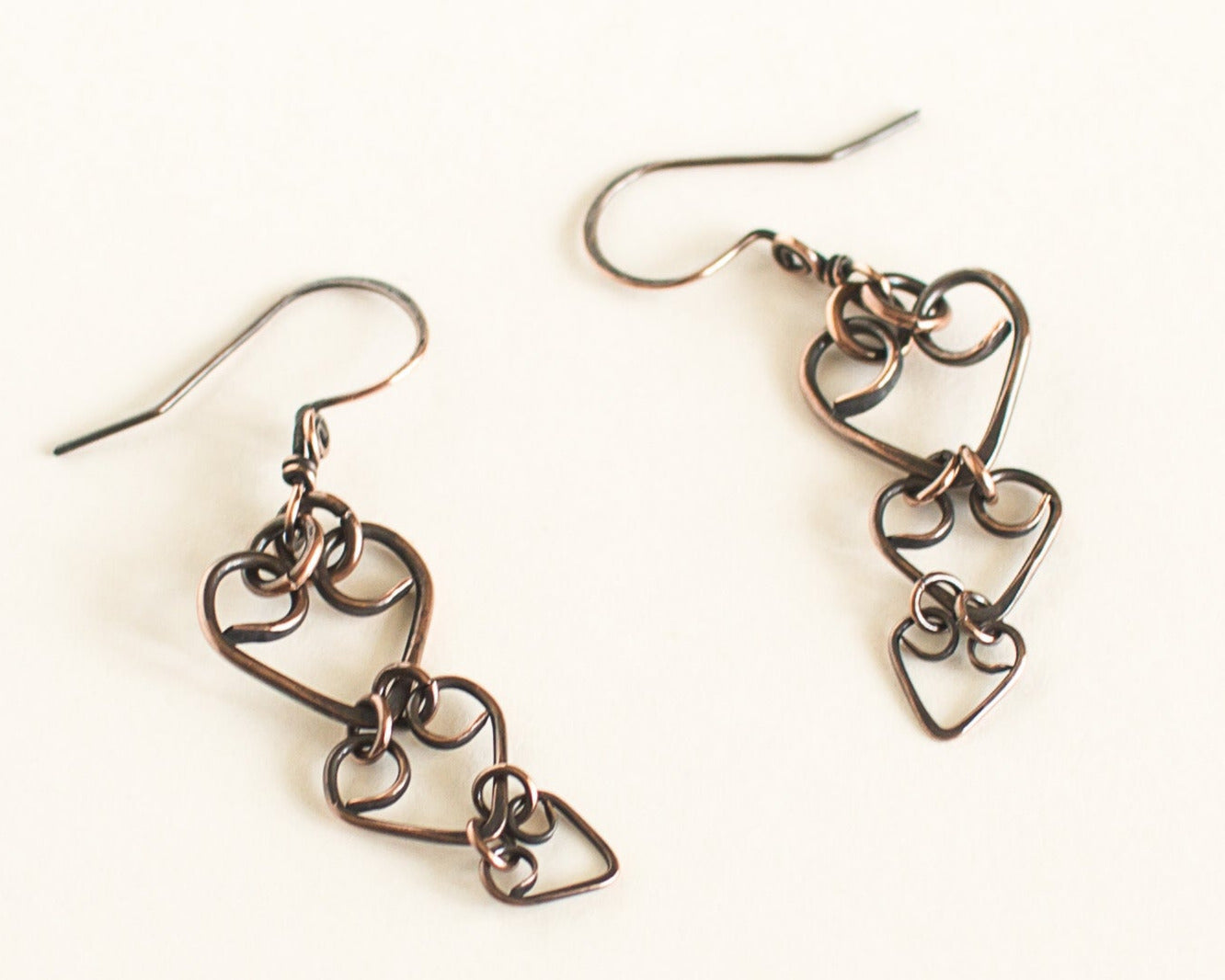 Pair of heart-shaped earrings on a white background