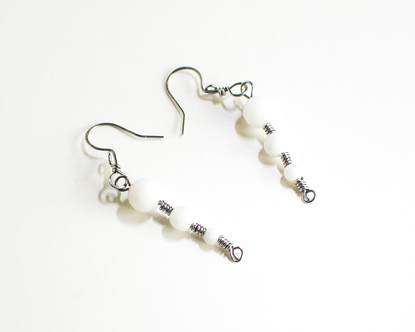 White Quartz earrings in Stainless Steel on a white background