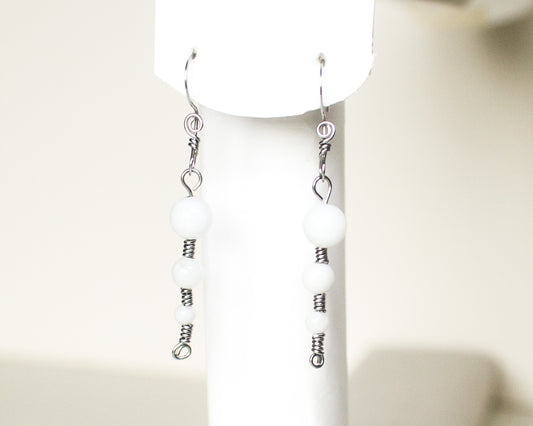 Pair of White Quartz Stainless Steel Earrings on a white background