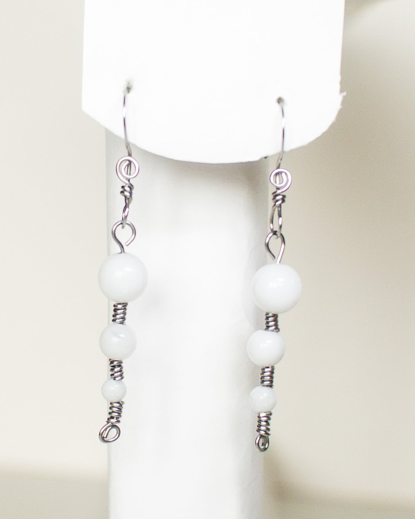 White quartz earrings on a white background