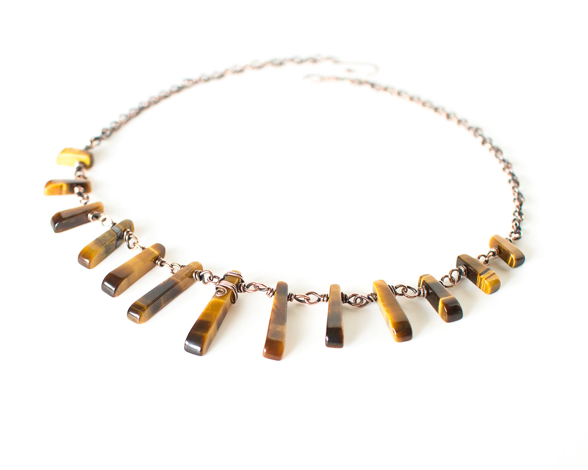 Necklace with tiger eye stones on a white background