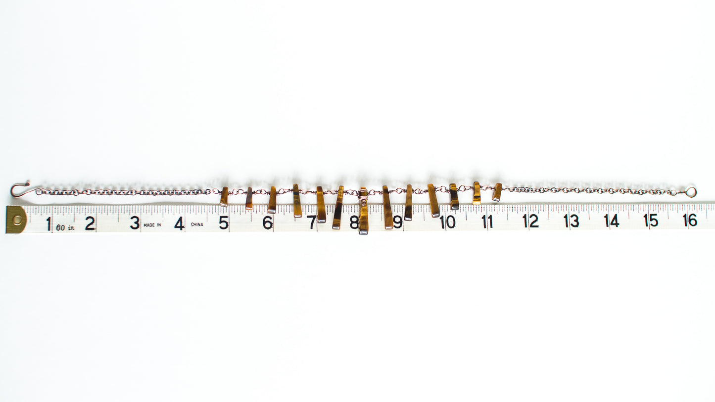 cooper chain necklace with tigerseye stones with measuring tape on a white background - showing a length of 16 inches or 40cm.